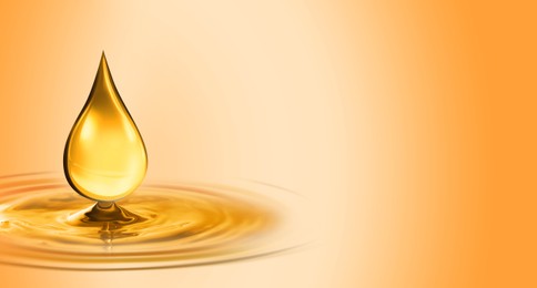 Image of Drop of cooking oil falling into oil on orange gradient background. Banner design with space for text