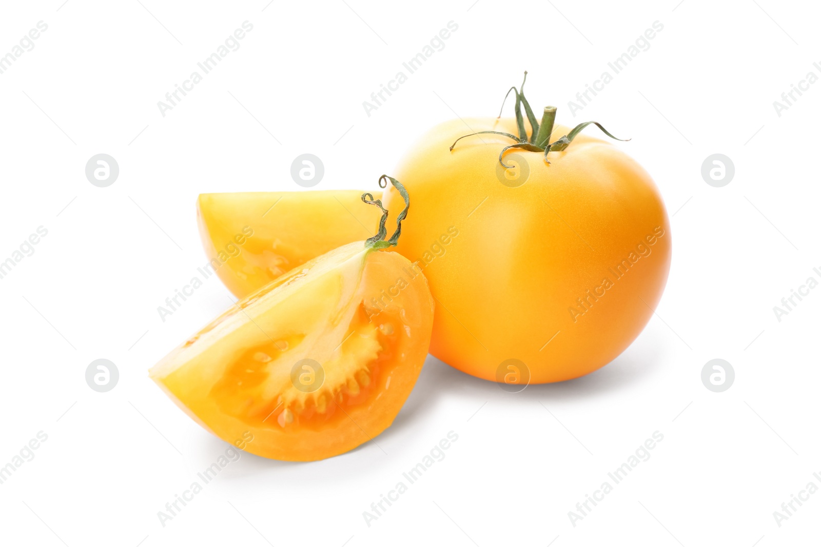 Photo of Cut ripe yellow tomatoes isolated on white