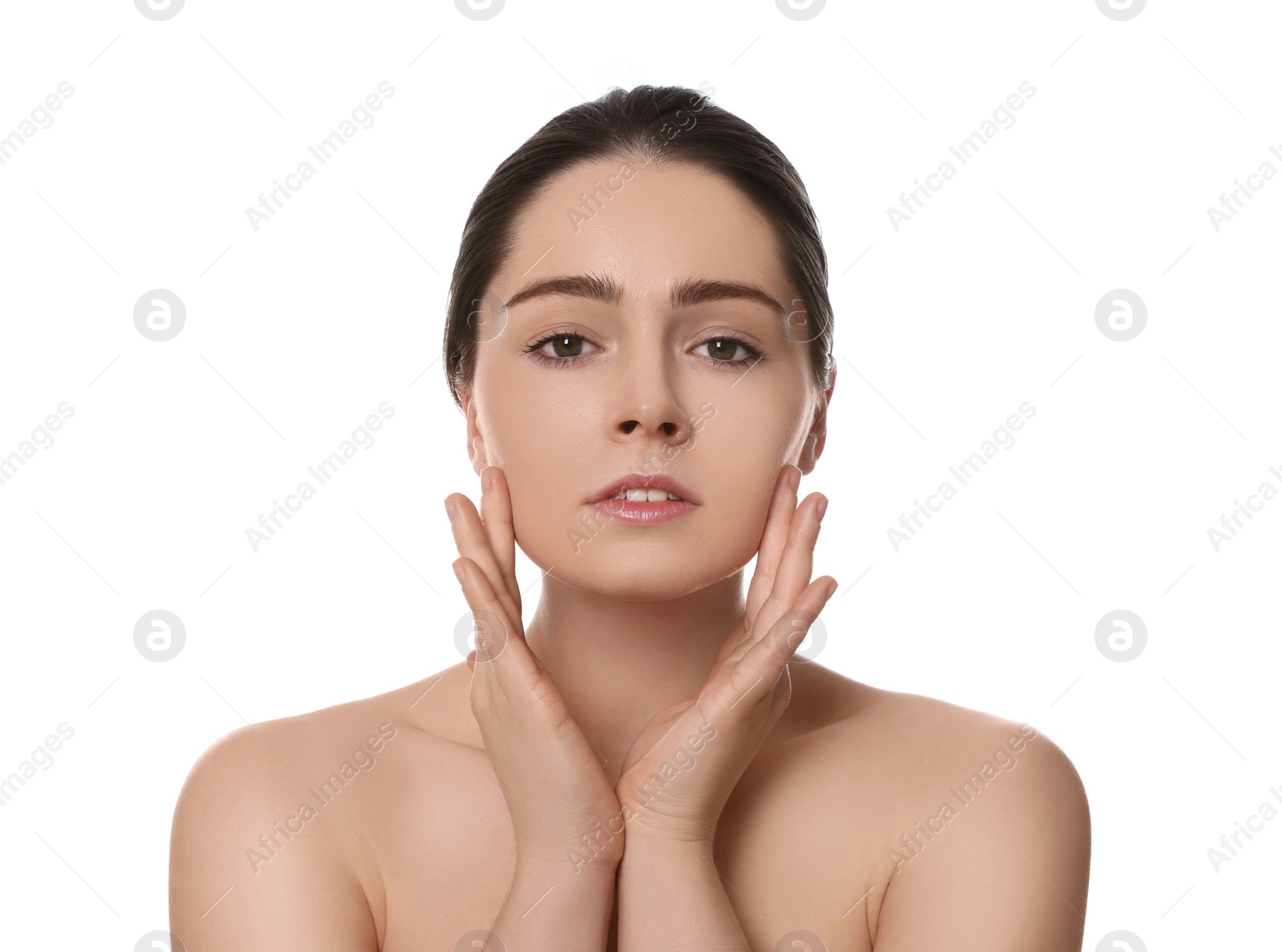 Photo of Young woman massaging her face on white background