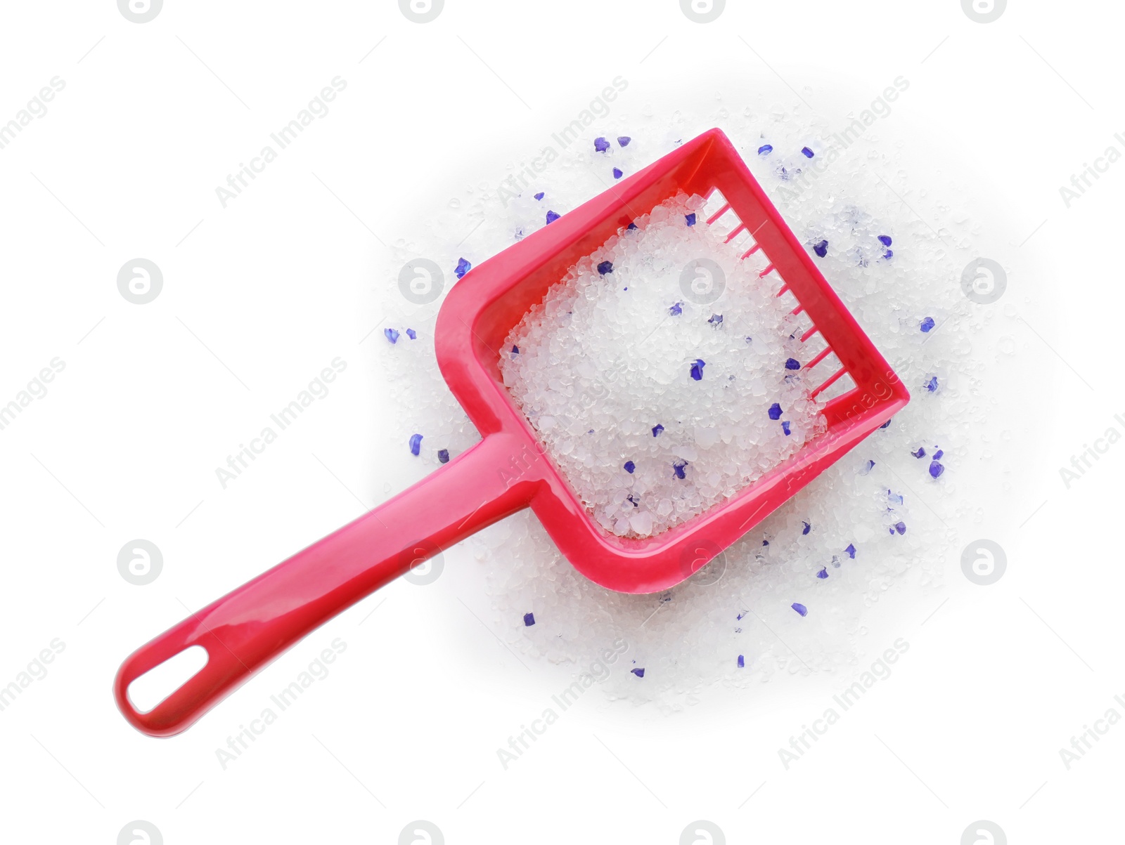 Photo of Red plastic scoop with cat litter isolated on white, top view