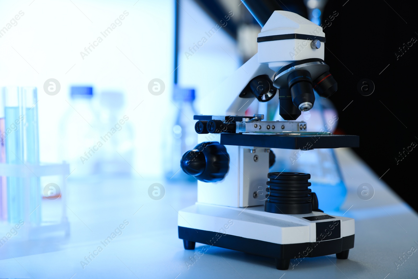 Photo of Modern microscope on table. Equipment for laboratory analysis