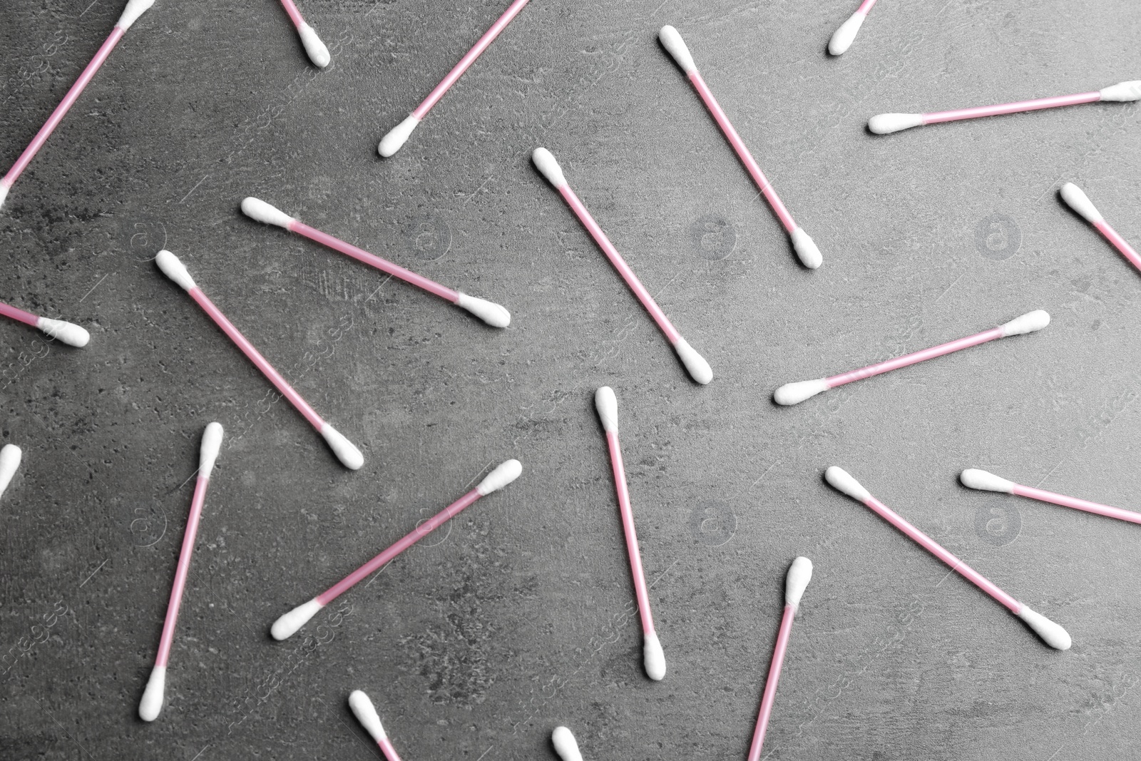 Photo of Flat lay composition with cotton swabs on grey background