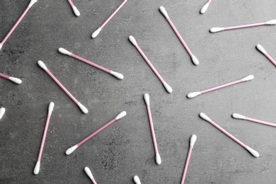 Flat lay composition with cotton swabs on grey background