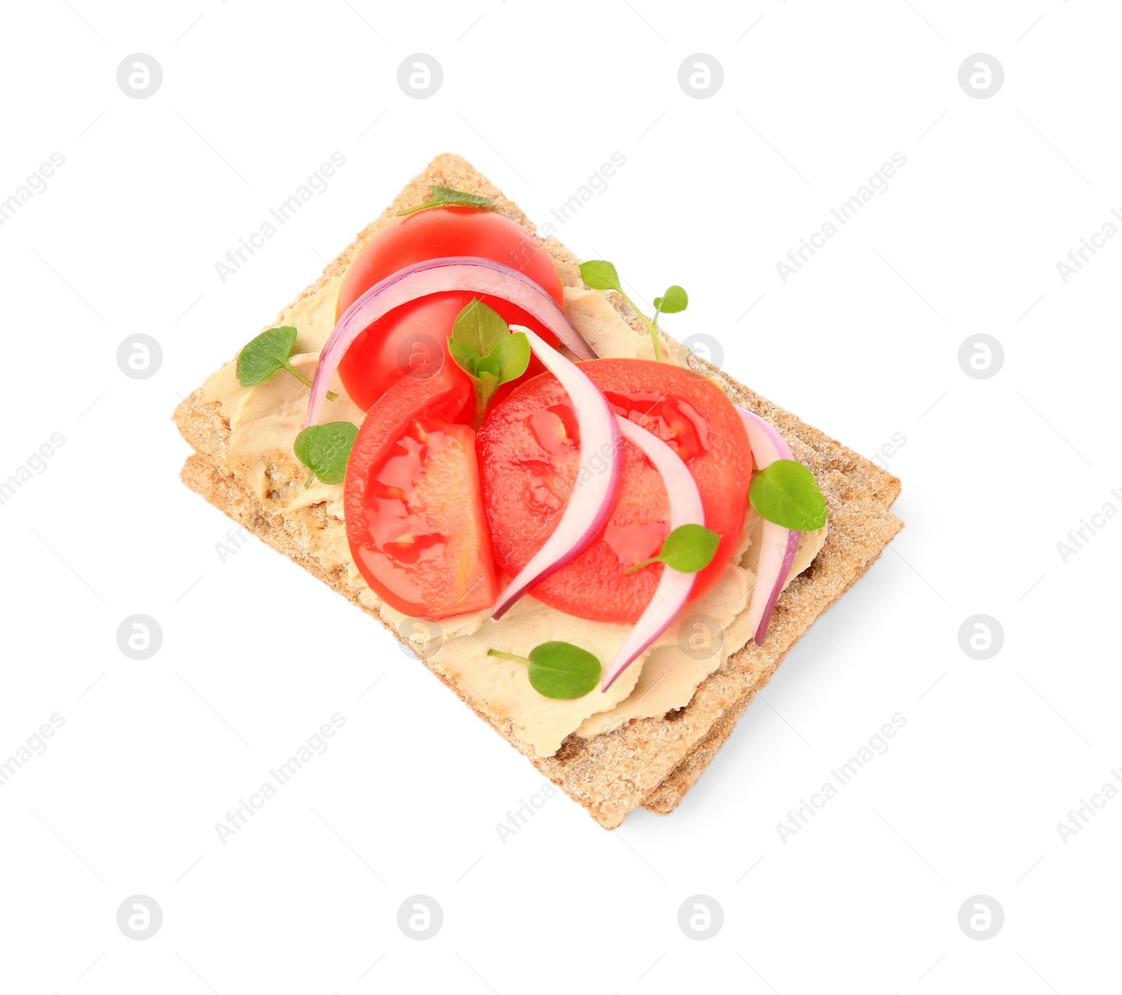 Photo of Fresh crunchy crispbreads with pate, tomatoes, red onion and greens isolated on white, top view