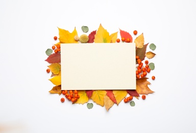 Photo of Flat lay composition with autumn leaves and blank card on white background, space for text