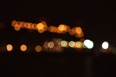 Photo of Blurred view of port at night. Bokeh effect