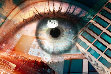 Image of Double exposure of modern buildings and woman with beautiful eye, closeup