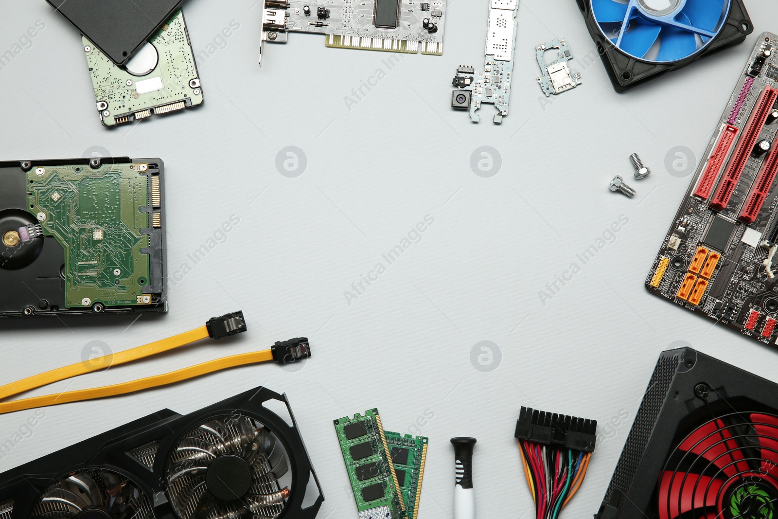 Photo of Frame of graphics card and other computer hardware on light background, flat lay. Space for text