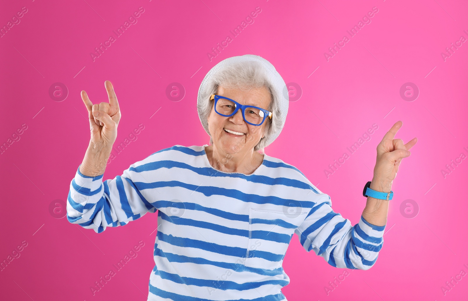 Photo of Portrait of cool grandmother on color background