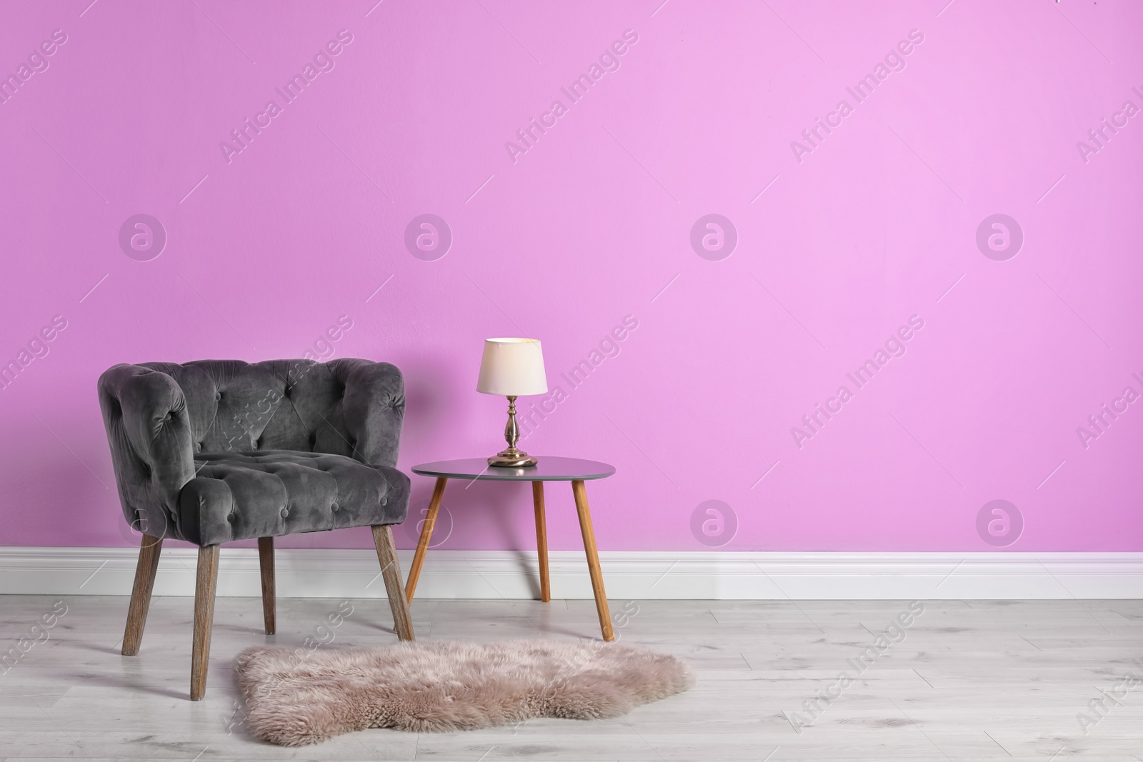 Photo of Comfortable armchair in stylish living room interior with space for text