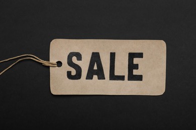 Sale tag on color background, top view. Black Friday