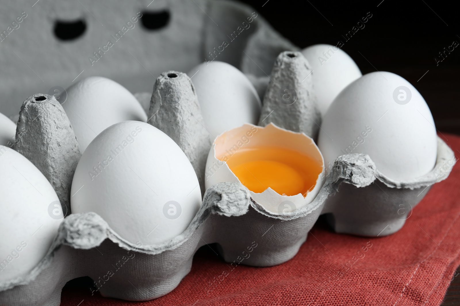 Photo of Fresh raw chicken eggs in box on table, closeup