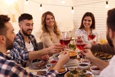 Group of people having brunch together at table indoors