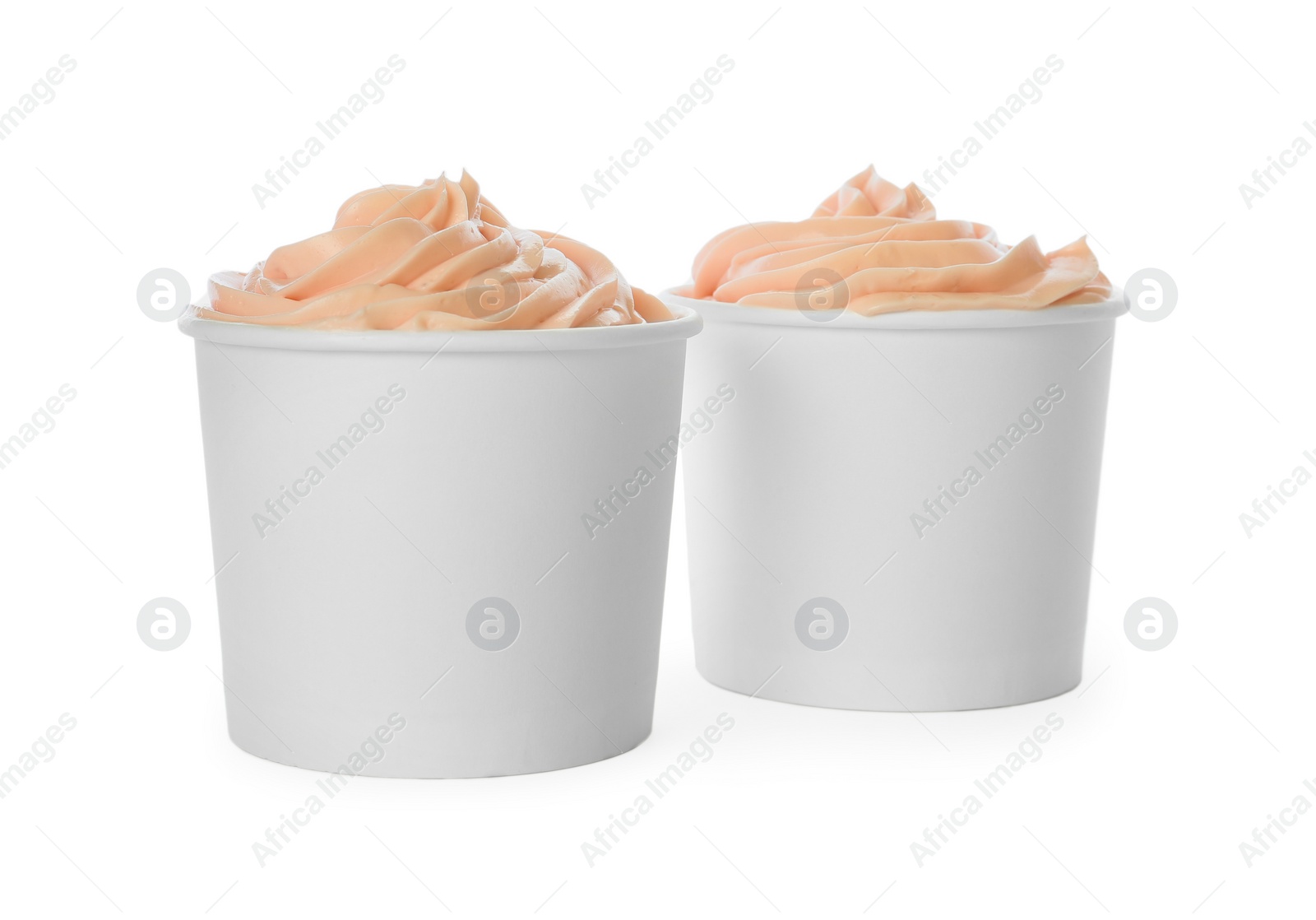 Photo of Cups with tasty frozen yogurt on white background