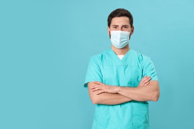 Photo of Nurse with medical mask on light blue background, space for text