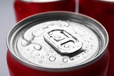 Energy drinks in wet cans, closeup. Functional beverage