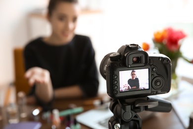 Photo of Female blogger on camera screen, closeup