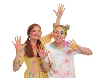 Photo of Women covered with colorful powder dyes on white background. Holi festival celebration