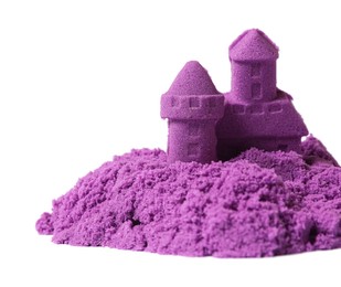 Photo of Castle made of purple kinetic sand isolated on white