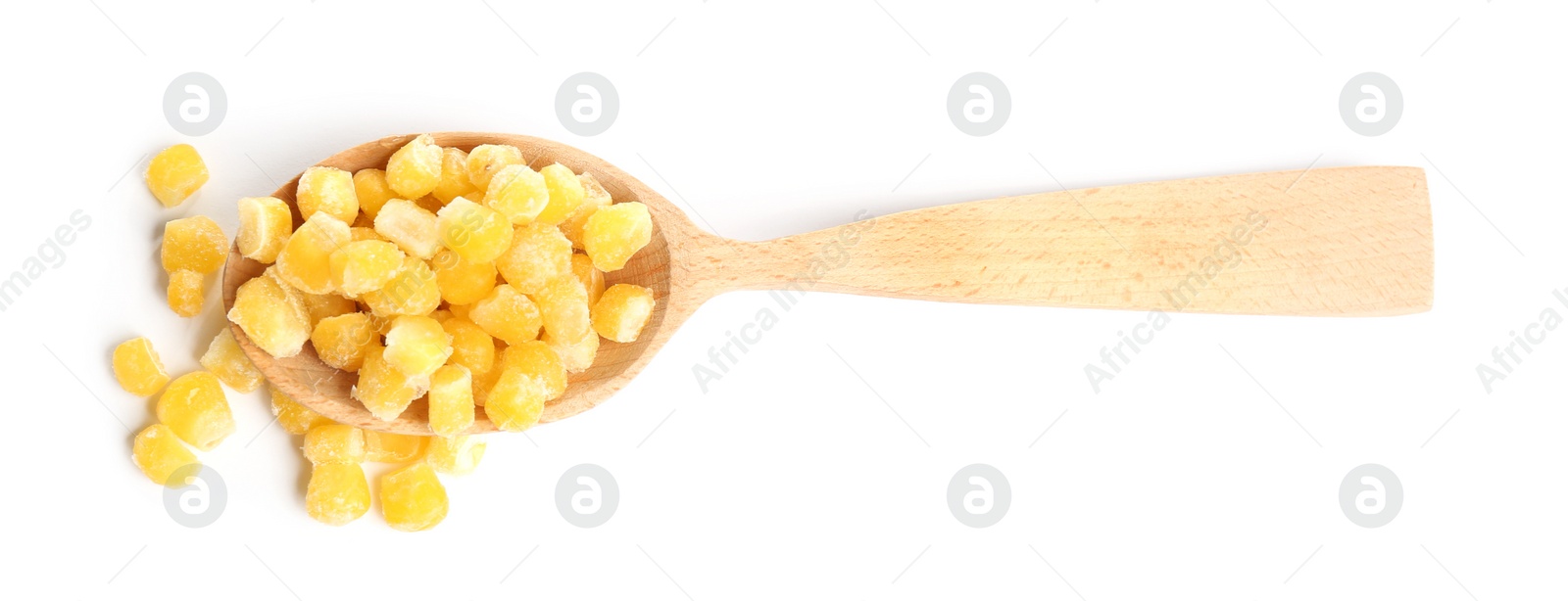 Photo of Frozen corn in wooden spoon isolated on white, top view. Vegetable preservation