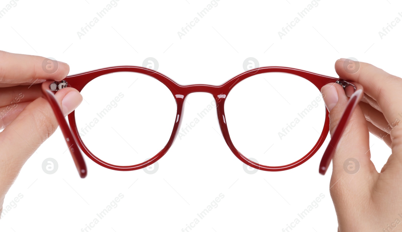 Photo of Woman holding stylish glasses with red frame on white background, closeup