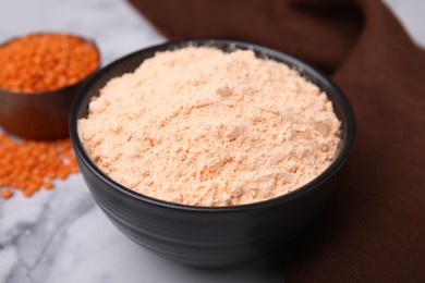 Lentil flour on white marble table, closeup