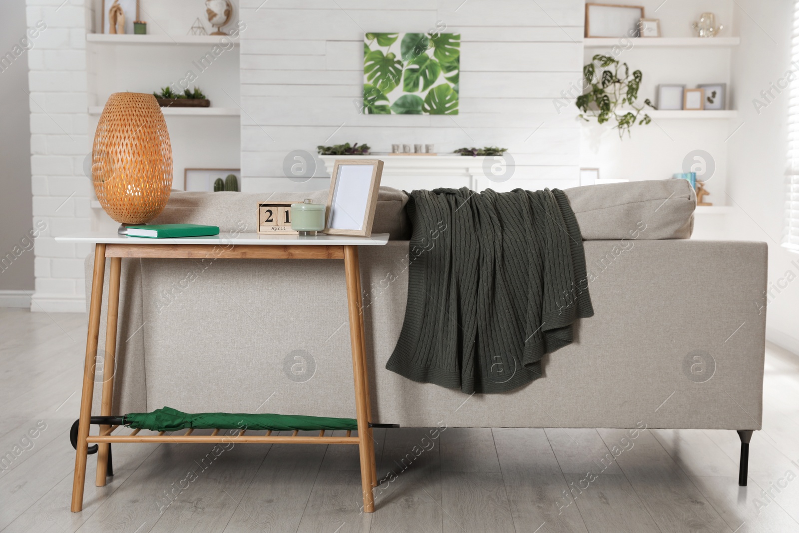 Photo of Living room interior with console table and stylish decor