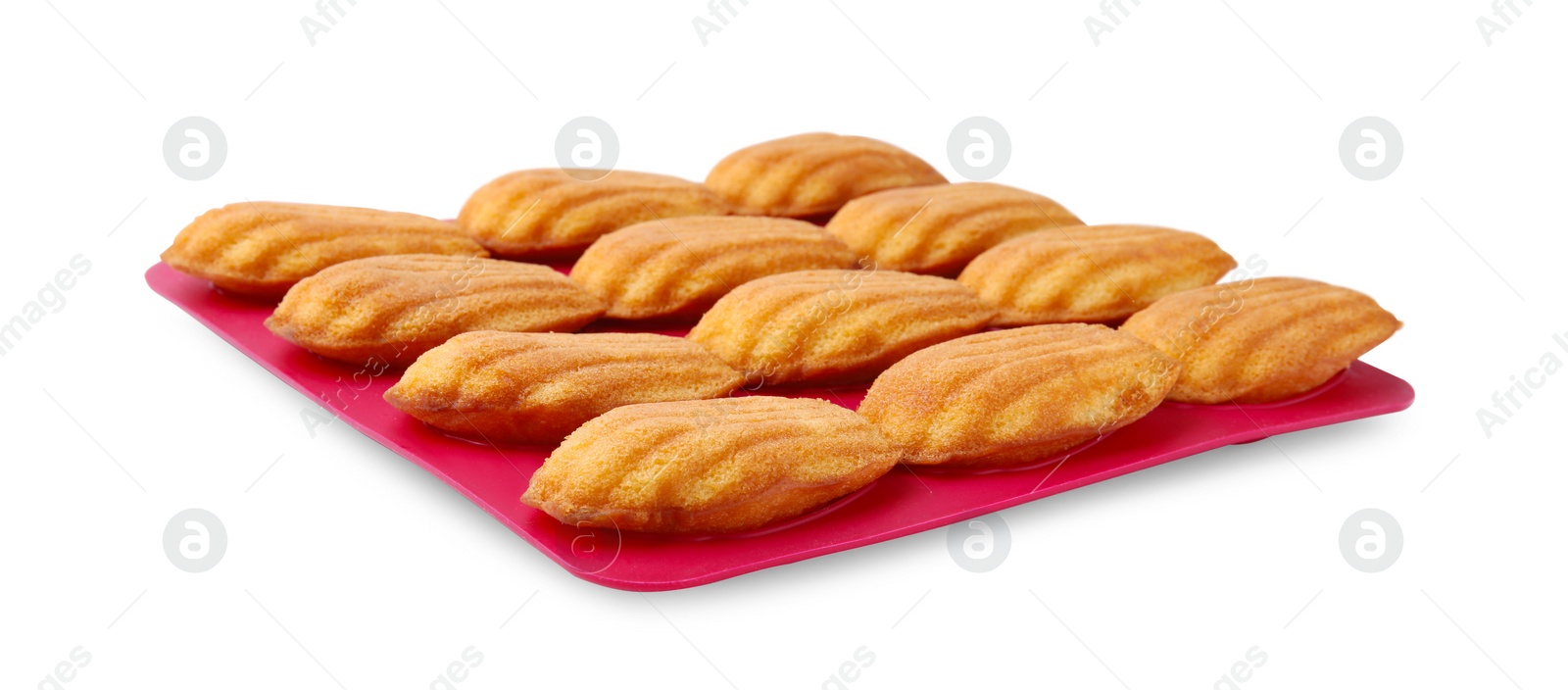 Photo of Many tasty madeleine cookies in baking mold isolated on white