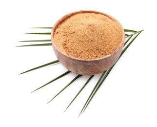 Photo of Coconut sugar in bowl and palm leaf isolated on white