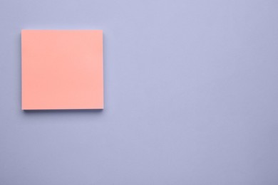 Photo of Paper note on light purple background, flat lay. Space for text