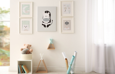 Photo of Beautiful pictures in stylish child's room interior