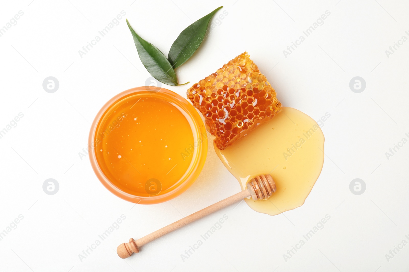 Photo of Composition with fresh honey on white background, top view