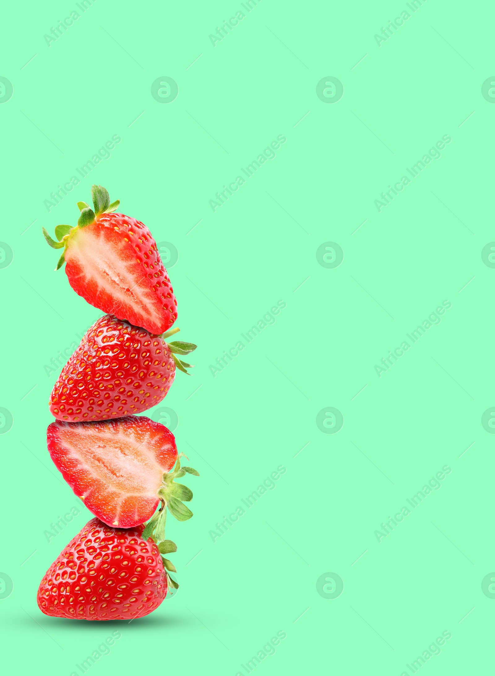 Image of Stack of fresh strawberries on aquamarine background, space for text