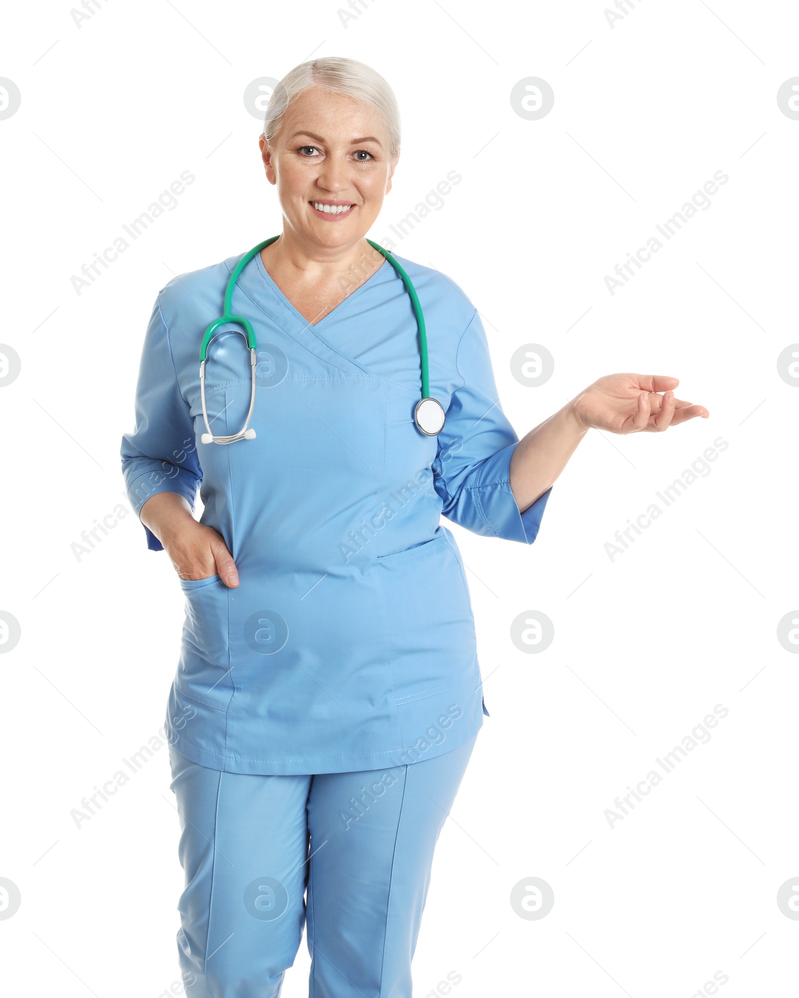 Photo of Portrait of female doctor in scrubs isolated on white. Medical staff