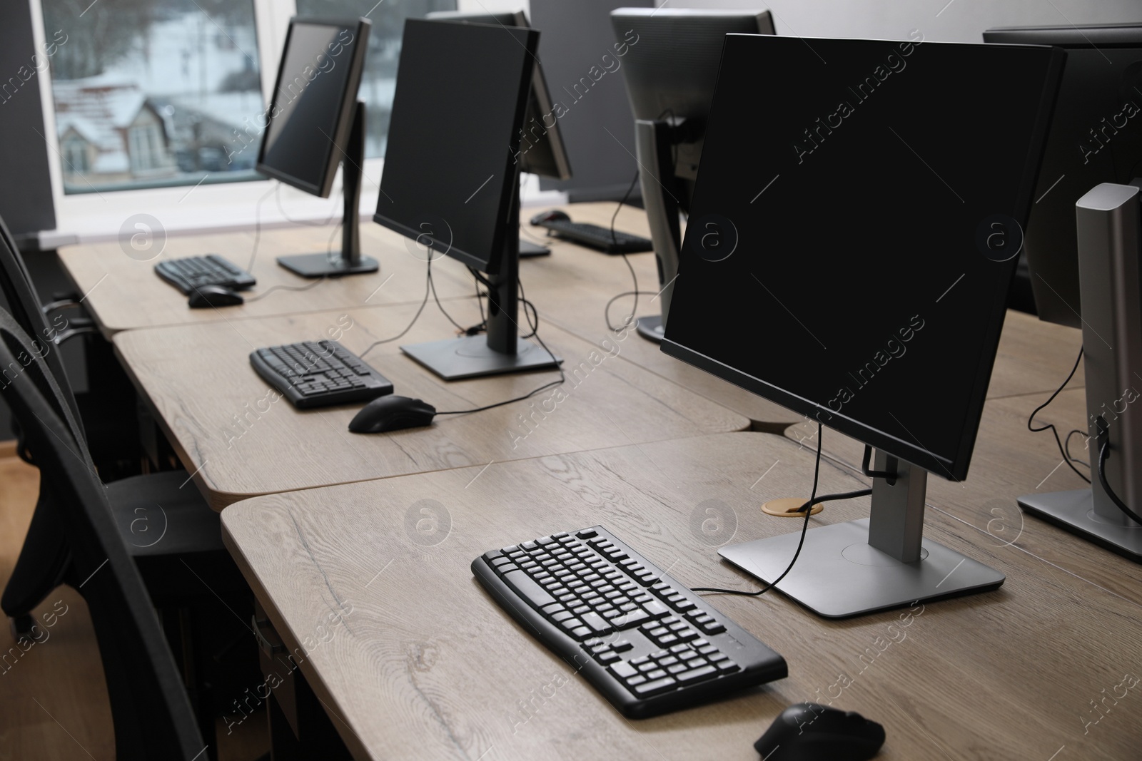 Photo of Many modern computers in open space office