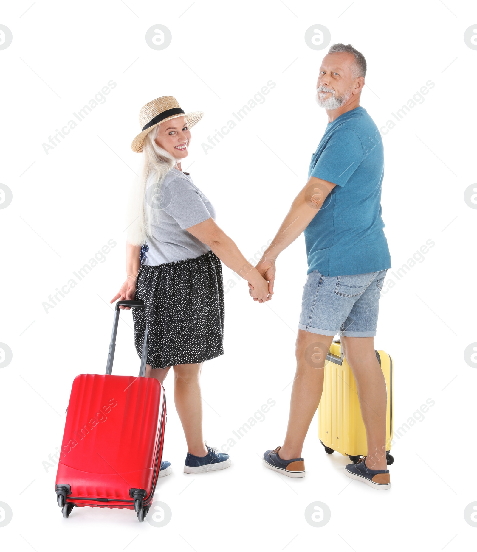 Photo of Senior couple with suitcases on white background. Vacation travel
