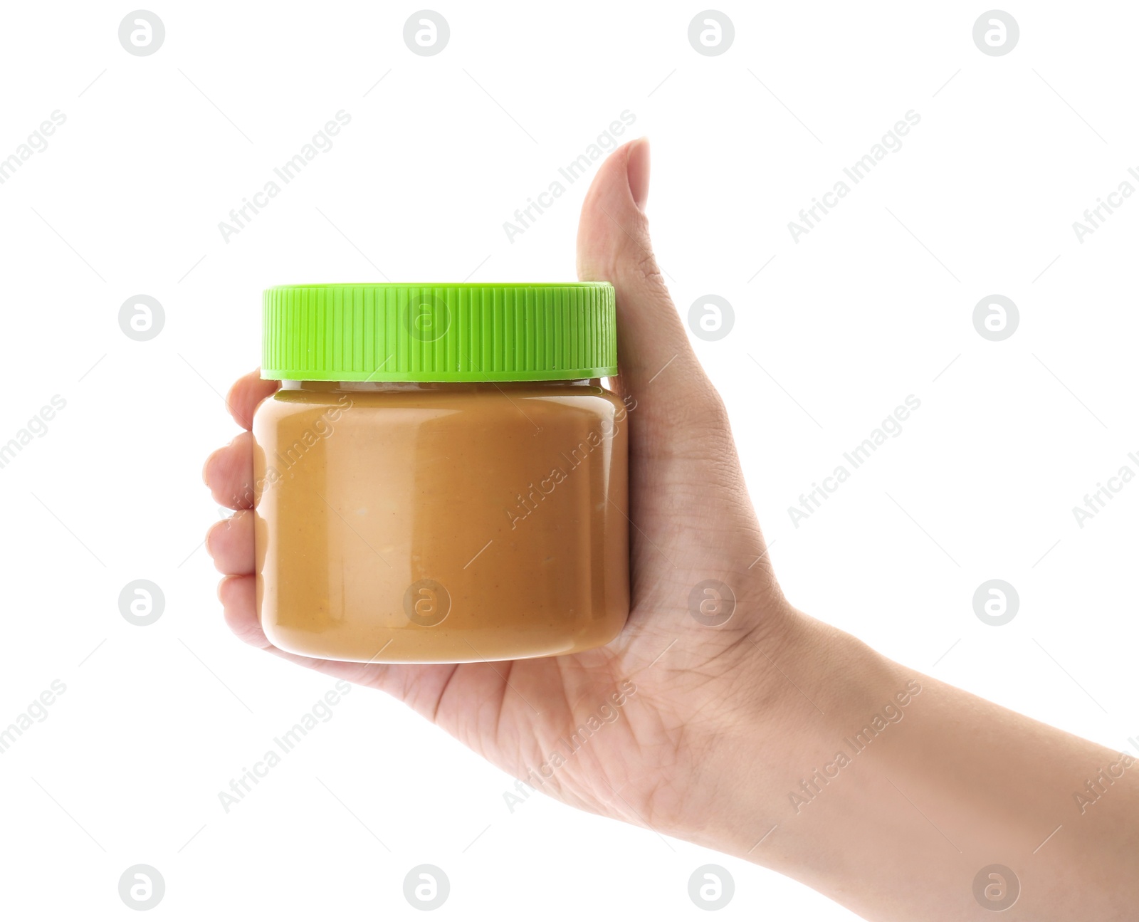 Photo of Woman holding jar with creamy peanut butter on white background