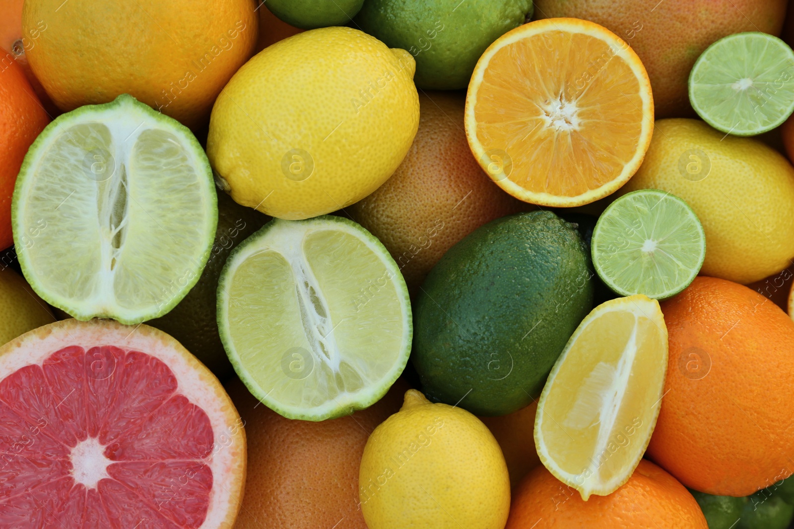 Photo of Different fresh citrus fruits as background, top view