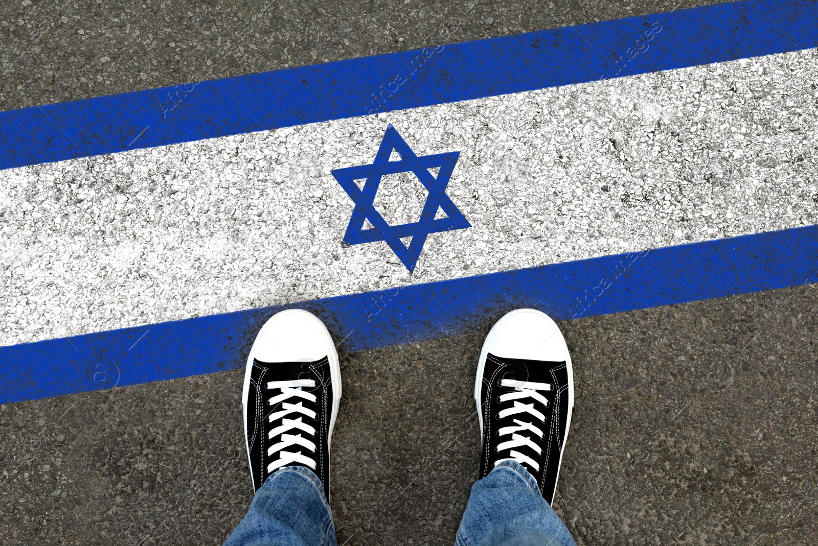 Image of Immigration. Man standing on asphalt near flag of Israel, top view