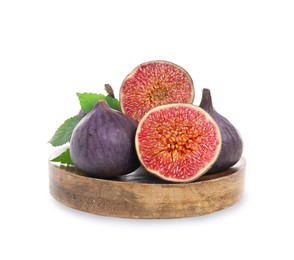 Wooden plate with whole and cut fresh purple figs isolated on white