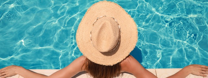 Image of Woman with straw hat in swimming pool on sunny day, banner design