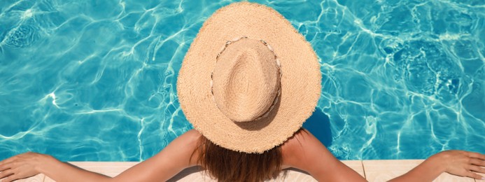 Woman with straw hat in swimming pool on sunny day, banner design