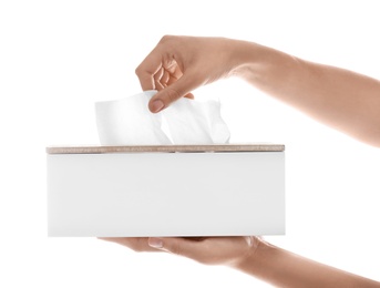 Photo of Woman taking paper tissue from holder on white background, closeup