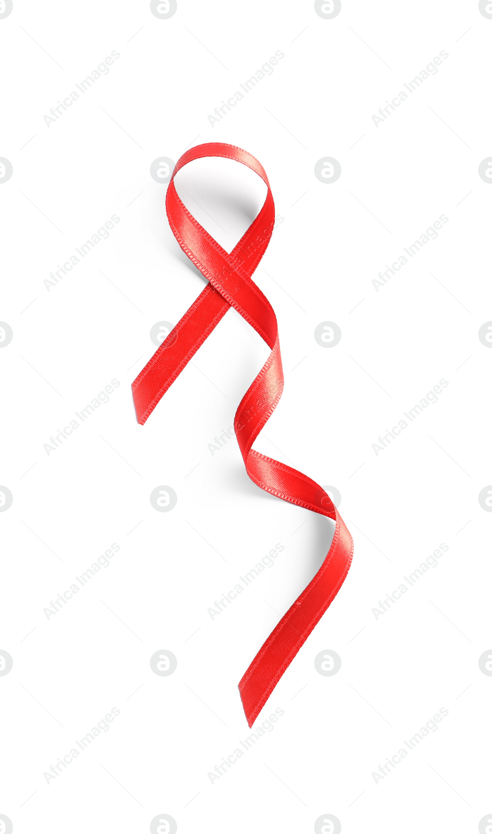 Photo of Red ribbon on white background, top view. Cancer awareness