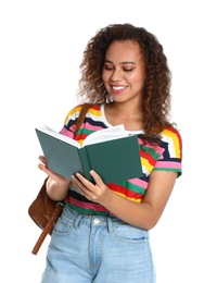 Beautiful African-American woman reading book on white background