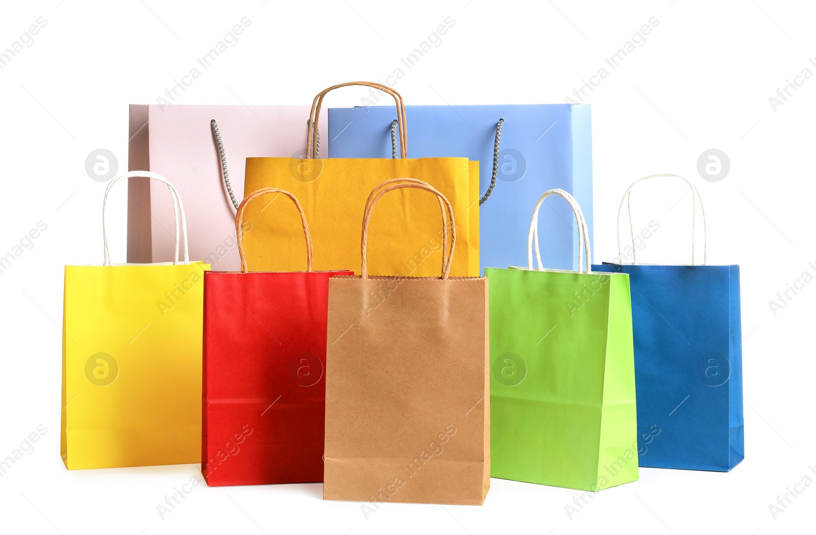 Photo of Colorful paper shopping bags on white background