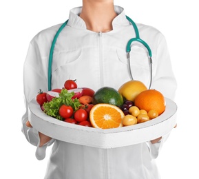 Photo of Female doctor with fresh products on white background. Cardiac diet