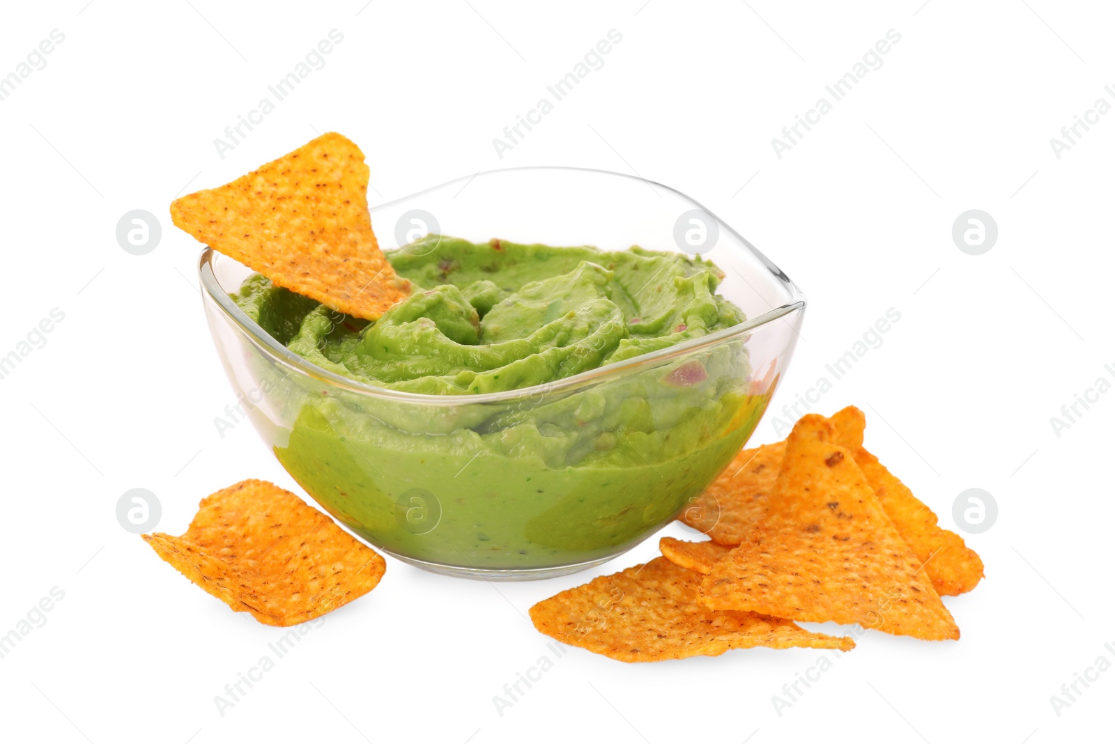 Photo of Bowl of delicious guacamole with nachos chips isolated on white