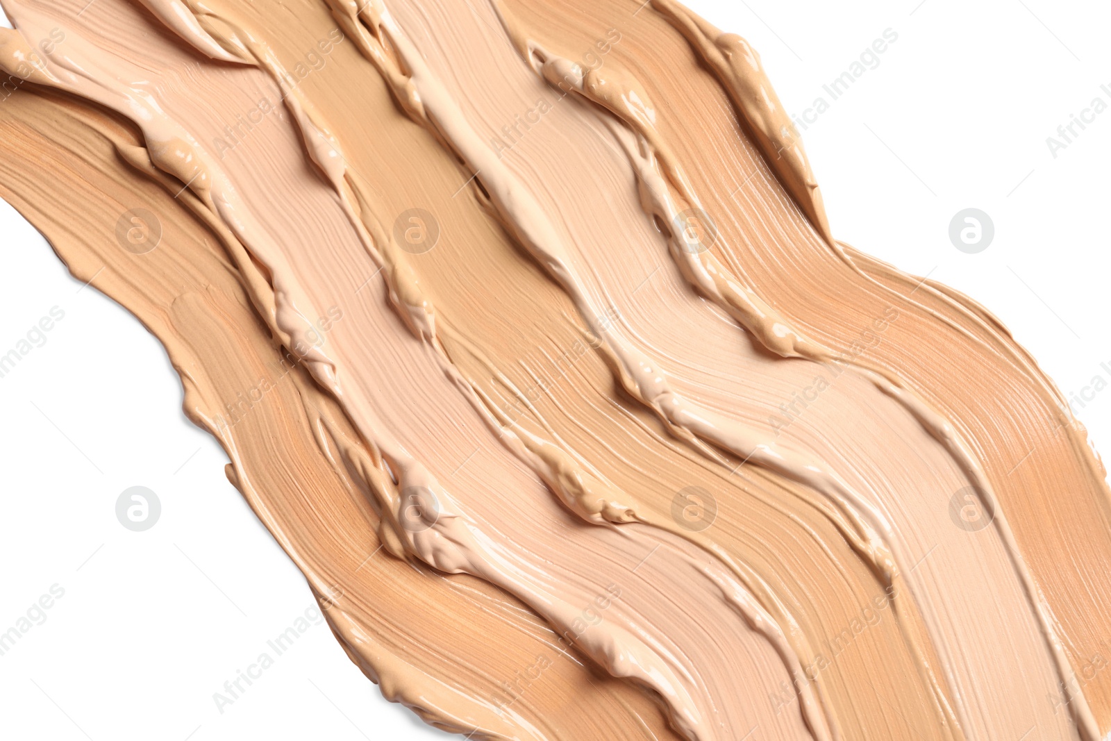 Photo of Samples of skin foundation on white background