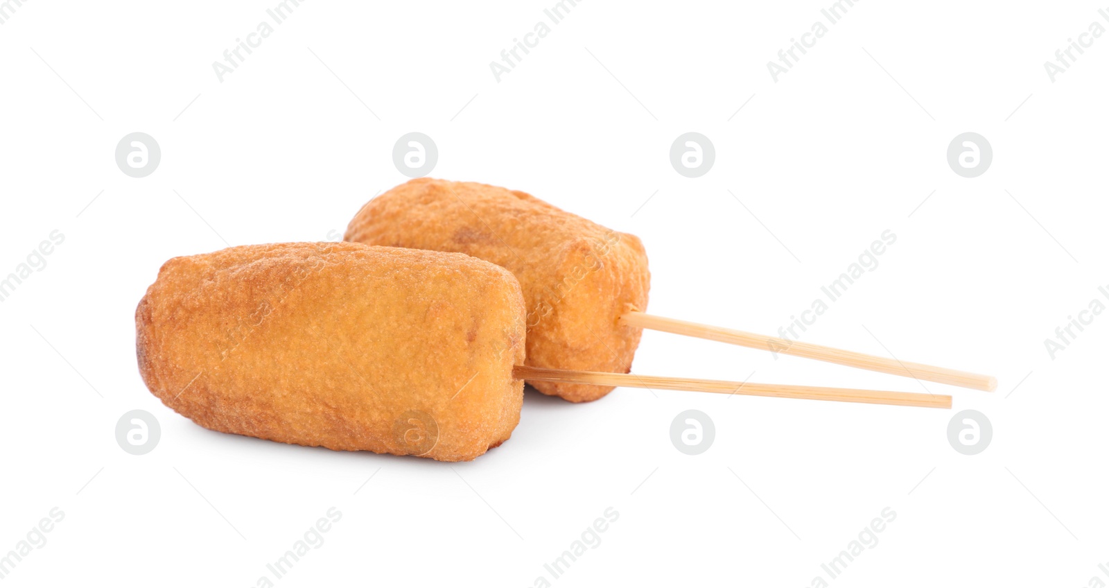 Photo of Delicious deep fried corn dogs isolated on white